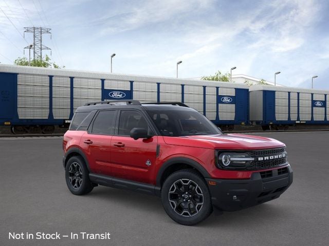 2026 Ford Bronco Sport Outer Banks in Ruby Red Metallic Tinted Clearcoat — front three-quarter view